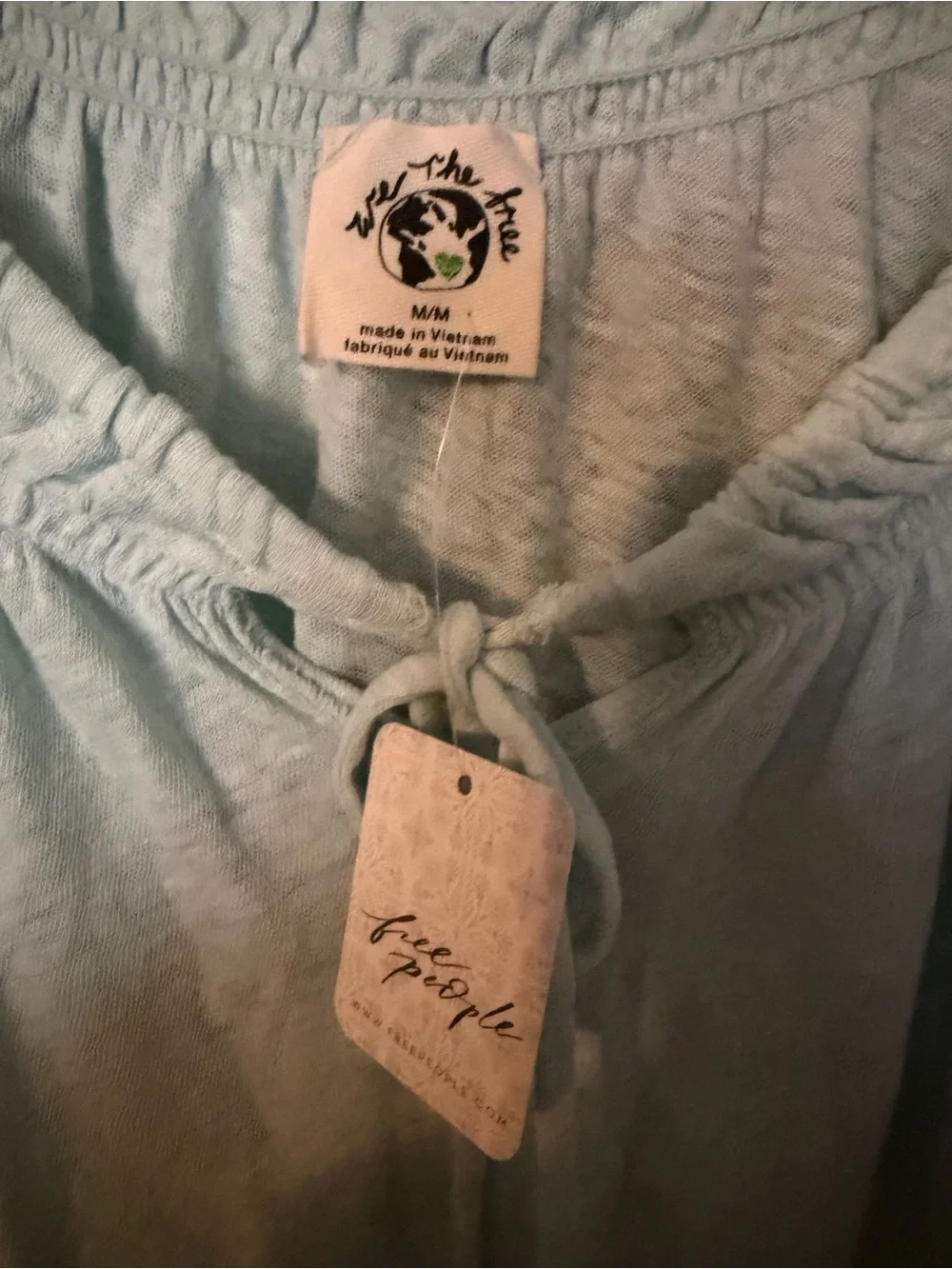 Brand new FREE PEOPLE brand.  We The Free Mint Green Peasant Tie-Front Tunic